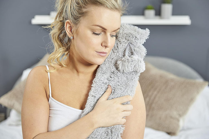Extra Long Hot Water Bottle with Super-Soft Grey Faux-Fur Cover and Matching Pom-Poms. 80Cm X 12Cm. 2 Litre